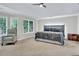 Spacious main bedroom featuring comfortable bed and large windows for natural light at 870 River Cliff Ct, Suwanee, GA 30024