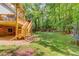 A spacious backyard featuring a trampoline and multi-level deck leading from the home at 905 Foxfire Dr, Lawrenceville, GA 30044
