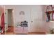 Light-filled room featuring custom wall art, an aquarium, and unique storage solutions at 905 Foxfire Dr, Lawrenceville, GA 30044