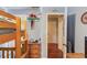 Spacious bedroom featuring bunk beds, hardwood floors, custom wall decor, and ample storage space at 905 Foxfire Dr, Lawrenceville, GA 30044