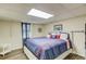Comfortable bedroom has a plush bed with a blue comforter and nautical-themed decorations at 905 Foxfire Dr, Lawrenceville, GA 30044