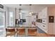 Bright kitchen featuring a granite island with bar seating and modern white cabinetry at 905 Foxfire Dr, Lawrenceville, GA 30044