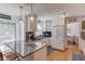 Modern kitchen featuring granite island with bar seating, stainless appliances, and bright white cabinetry at 905 Foxfire Dr, Lawrenceville, GA 30044