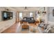 Spacious living room featuring hardwood floors, a fireplace, and comfortable seating arrangements at 905 Foxfire Dr, Lawrenceville, GA 30044