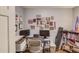Functional home office featuring ample shelving, a large desk, and plenty of natural light at 905 Foxfire Dr, Lawrenceville, GA 30044