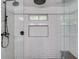 This shower features black fixtures, white subway tile, a built-in seat and a convenient niche at 905 Foxfire Dr, Lawrenceville, GA 30044