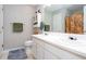 Bathroom with double sink vanity, a large mirror, and plenty of storage space and linen closet at 1122 Cotton Gin Dr, Woodstock, GA 30188