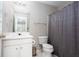 Cozy bathroom featuring a vanity, toilet, and shower with a gray curtain at 1122 Cotton Gin Dr, Woodstock, GA 30188