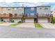 Row of townhomes with individual garages and wooden decks on the back at 1122 Cotton Gin Dr, Woodstock, GA 30188