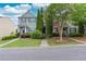 Charming townhouse showcasing manicured landscaping, a well-maintained lawn, and inviting curb appeal at 1122 Cotton Gin Dr, Woodstock, GA 30188