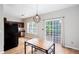Bright eat-in kitchen with stainless steel appliances and wood floors at 1122 Cotton Gin Dr, Woodstock, GA 30188