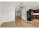 Open kitchen featuring a black refrigerator, cherry cabinets, and hardwood floors at 1122 Cotton Gin Dr, Woodstock, GA 30188