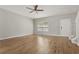 Bright living room featuring hardwood floors, a ceiling fan and neutral walls at 1122 Cotton Gin Dr, Woodstock, GA 30188