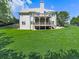 Large backyard featuring a covered deck perfect for entertaining, and well-maintained lawn at 237 Libby Ln, Canton, GA 30115