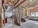 Unfinished basement space ready for customization, featuring exposed beams and insulation for a rustic feel at 237 Libby Ln, Canton, GA 30115