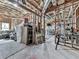 Unfinished basement with exposed beams and utilities, offering potential for a customizable recreation or storage space at 237 Libby Ln, Canton, GA 30115