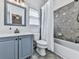 Bathroom with a vanity, framed mirror, and a bathtub with a shower at 237 Libby Ln, Canton, GA 30115