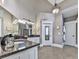 Bathroom featuring granite countertops, tile flooring, a vanity, and a framed mirror at 237 Libby Ln, Canton, GA 30115