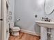 Charming powder room with a pedestal sink and decorative furnishings at 237 Libby Ln, Canton, GA 30115