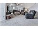 Spacious bonus room with plush carpet, neutral walls, and plenty of seating with a ceiling fan at 237 Libby Ln, Canton, GA 30115