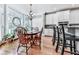 Dining area boasts wood floors, chandelier, and a view to the kitchen and backyard at 237 Libby Ln, Canton, GA 30115