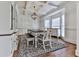 Elegant dining area featuring coffered ceilings, bay window, chandelier and hardwood floors at 237 Libby Ln, Canton, GA 30115