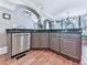 Modern kitchen showcases stainless steel appliances, wooden floors, gray cabinets, and granite countertops at 237 Libby Ln, Canton, GA 30115