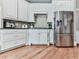 Modern kitchen with stainless steel appliances and white cabinets at 237 Libby Ln, Canton, GA 30115