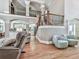 Open-concept floor plan featuring high ceilings, living area, staircase, and view of the kitchen at 237 Libby Ln, Canton, GA 30115