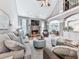 Open living room with fireplace, large windows, archway to the dining area and hardwood flooring at 237 Libby Ln, Canton, GA 30115