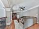 Upstairs living room with hardwood floors, gray walls, a bookshelf, and comfortable couches at 237 Libby Ln, Canton, GA 30115