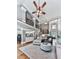 Bright open-concept living room with staircase, hardwood floors, and a view to the kitchen at 237 Libby Ln, Canton, GA 30115