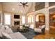 Spacious living room with vaulted ceilings, fireplace, and an open layout to the kitchen at 237 Libby Ln, Canton, GA 30115