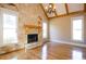 Bright living room with a stone fireplace, hardwood floors, and large windows at 237 Libby Ln, Canton, GA 30115