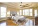 Serene main bedroom featuring tray ceilings, large windows, and hardwood floors at 237 Libby Ln, Canton, GA 30115