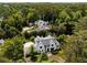 Overhead view of a luxurious residence perfectly situated in a verdant, upscale neighborhood with mature trees and landscaping at 3773 Randall Se Rd, Atlanta, GA 30339