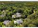 Aerial view of a sprawling estate nestled among trees and other luxury homes in an affluent neighborhood at 3773 Randall Se Rd, Atlanta, GA 30339