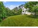 Lush green backyard with mature trees, providing privacy and a serene outdoor space at 3773 Randall Se Rd, Atlanta, GA 30339