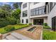 Beautiful backyard with a modern water feature surrounded by lush landscaping at 3773 Randall Se Rd, Atlanta, GA 30339