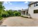 This backyard features a large concrete patio and well-maintained landscaping, providing an ideal space for outdoor activities at 3773 Randall Se Rd, Atlanta, GA 30339
