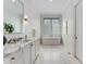 Bathroom features white marble floors, soaking tub, and bright lighting at 3773 Randall Se Rd, Atlanta, GA 30339