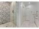 Bathroom with a marble shower and countertops, and white cabinets at 3773 Randall Se Rd, Atlanta, GA 30339