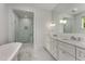 Bathroom featuring double vanity with marble countertops and tiled floors, and a glass shower at 3773 Randall Se Rd, Atlanta, GA 30339
