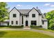 Stunning two-story home with a manicured lawn and lush landscaping at 3773 Randall Se Rd, Atlanta, GA 30339