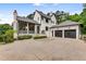 Beautiful home with a large driveway leading to a two-car garage and charming front porch at 3773 Randall Se Rd, Atlanta, GA 30339