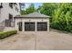 Modern two-car garage with dark doors, located next to the main house at 3773 Randall Se Rd, Atlanta, GA 30339