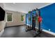 Bright home gym with weight training equipment and natural light from two windows at 3773 Randall Se Rd, Atlanta, GA 30339