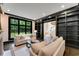 Stylish living room featuring built-in bookshelves and a large window at 3773 Randall Se Rd, Atlanta, GA 30339