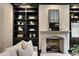 Cozy living room with a stone fireplace and custom built-in shelving at 3773 Randall Se Rd, Atlanta, GA 30339