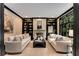 Beautiful living room with dark trim, and built-in bookcases and fireplace at 3773 Randall Se Rd, Atlanta, GA 30339